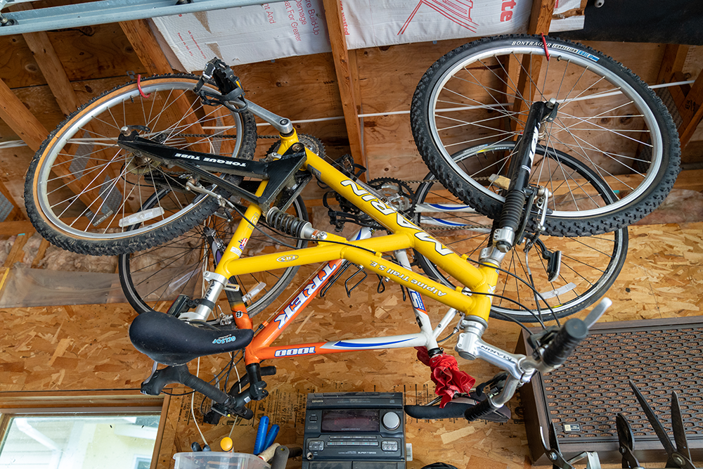 Bike hanging from ceiling in garage